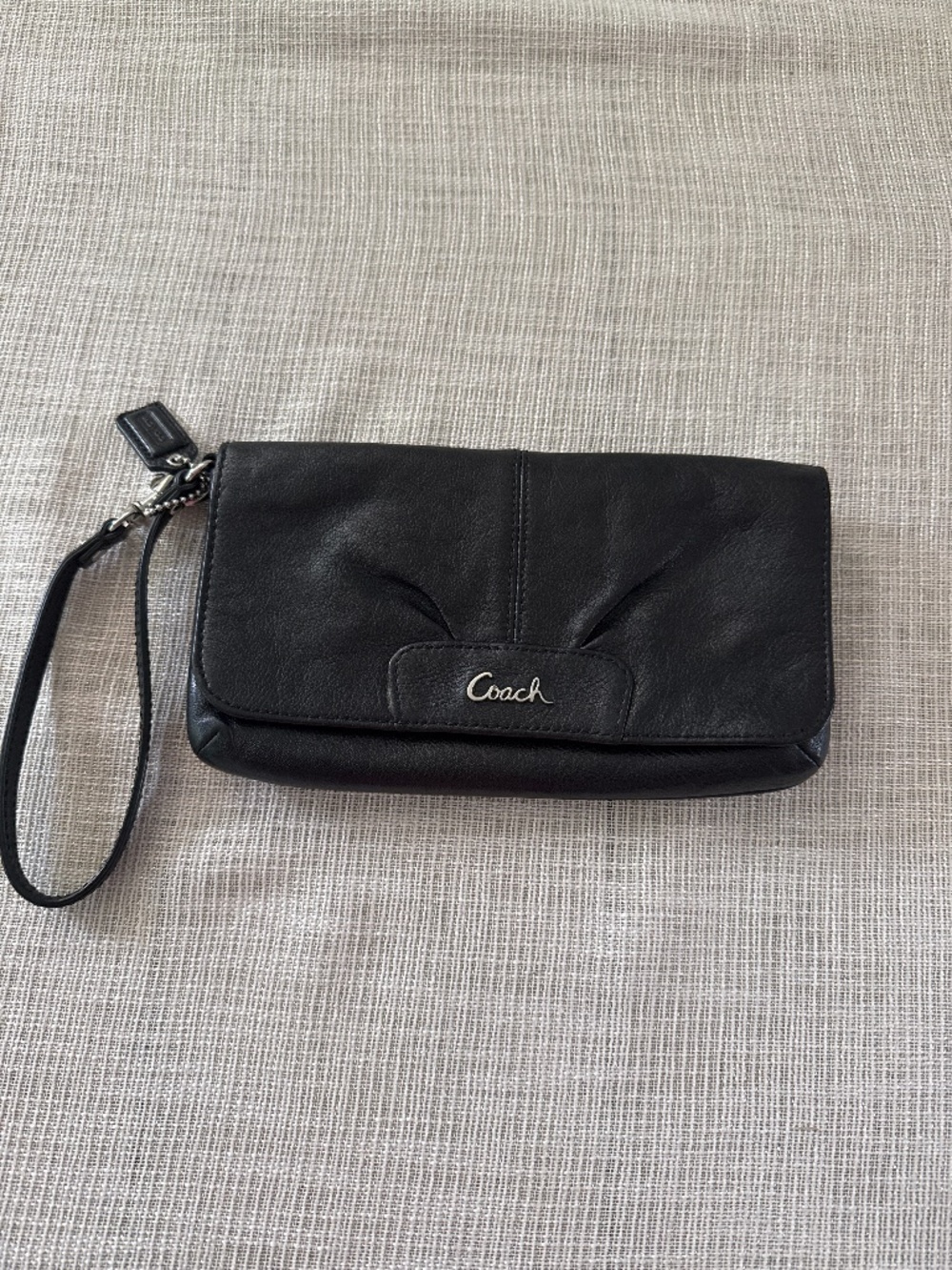 Black leather Coach wristlet